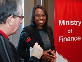 Mitzie Hunter looks on as Peterborough MPP Jeff Leal addresses participants during a consultation on the Ontario Retirement Pension Plan (ORPP) held at the Holiday Inn in Peterborough, Jan. 22, 2015. (Clifford Skarstedt/Peterborough Examiner/Postmedia Network)