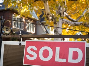 A real estate sold sign hangs in front of a west-end Toronto property Friday, Nov. 4, 2016. (THE CANADIAN PRESS)