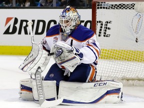 Edmonton Oilers goalie Cam Talbot (33) stops as shot against the San Jose Sharks during the first period in Game 3 of a first-round NHL hockey playoff series Sunday, April 16, 2017, in San Jose, Calif.