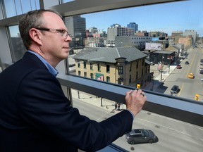 Libro chief executive Stephen Bolton overlooks Clarence and King streets from his office window, the fulcrum of London?s proposed BRT system. Bolton says the city needs infrastructure to be competitive and he supports bus rapid transit. (MORRIS LAMONT, The London Free Press)