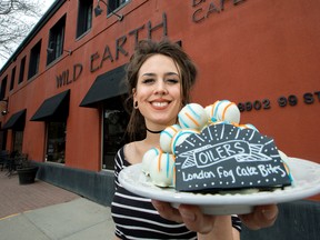 Madeline Slind holds a plate of Oilers cake bites at the Wild Earth Bakery & Cafe, 8902 99 St., in Edmonton on Monday, April 17, 2017.