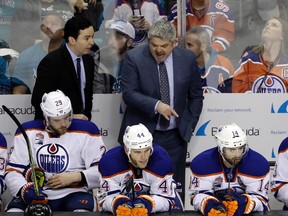 Edmonton Oilers head coach Todd McLellan, right, instructs his team during the third period in Game 3 of a first-round NHL hockey playoff series against the San Jose Sharks Sunday, April 16, 2017, in San Jose, Calif. Edmonton won, 1-0, in Game 3