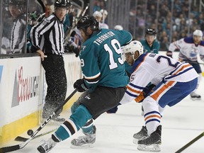 Joe Thornton #19 of the San Jose Sharks battles for control of the puck with Darnell Nurse #25 of the Edmonton Oilers during the second period in Game Three of the Western Conference First Round during the 2017 NHL Stanley Cup Playoffs at SAP Center on April 16, 2017 in San Jose, California. The Oilers won the game 1-0