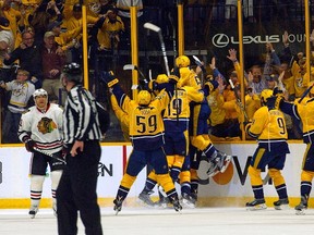 The Nashville Predators charge the ice after defeating the Chicago Blackhawks in overtime in Game Three of the Western Conference First Round during the 2017 NHL Stanley Cup Playoffs at Bridgestone Arena on April 17, 2017 in Nashville, Tennessee.  (Photo by Frederick Breedon/Getty Images)