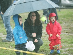 Parents were equipped with umbrellas while the children sported their rain gear at the 2017 annual Community Easter Egg Hunt April 15.(Shaun Gregory/Huron Expositor)