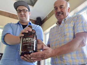 One of the Bayside Brewery founders Frank Thompson, right, and his son Wesley were at the Rotary Club of Chatham last year to talk about the company. They are celebrating its fifth anniversary later this year, July 27.