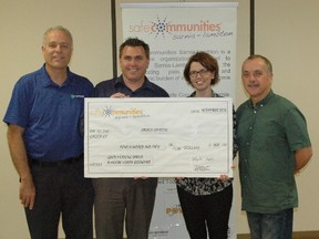 Members of Safe Communities Sarnia-Lambton present a cheque of $450 to Lambton Circles' Megan O'Neil after last October's Mental Health Breakfast. Safe Communities will be hosting a Mental Health Luncheon on Apr. 27 in support of Rebound Sarnia-Lambton and Goodwill Industries. 
Handout/Sarnia This Week