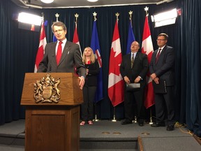 Liberal leader David Swann speaks at a press conference demanding an extension of the government's labour legislation review. He is joined by (from left) Amber Ruddy, of the Canadian Federation of Independent Business, Progressive Conservative MLA Richard Gotfried and Wildrose MLA Glenn van Dijken. Photo by Stuart Thomson.