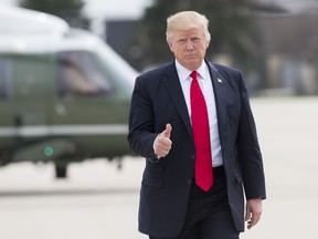 US President Donald Trump gives a thumbs-up as he walks to Marine One at General Mitchell International Airport in Milwaukee, Wisconsin, April 18, 2017, prior to returning to Washington following a trip to Kenosha, Wisconsin, to speak at Snap-On Tools.  (SAUL LOEB/AFP/Getty Images)