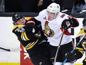 Ottawa Senators centre Jean-Gabriel Pageau drops Boston Bruins defenceman Charlie McAvoy with a hard check during Game 3 on April 17, 2017. (AP Photo/Charles Krupa)