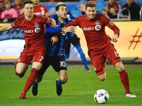 Toronto FC's Eriq Zavaleta (right) competes for the ball during a game against Montreal last season. (THE CANADIAN PRESS)