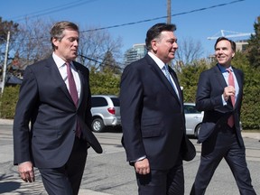 Federal Finance Minister Bill Morneau (right) Provincial Finance Minister Charles Sousa (centre) and Toronto Mayor John Tory leave a meeting on Tuesday, April 18, 2017, after talks on the housing market in the Greater Toronto Area. (THE CANADIAN PRESS/PHOTO)