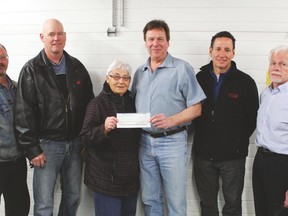 Pictured (l. to r.) Gerry Dufault, Brian Newberry, Hy Dahl, Terry Primeau, Paul Mitchell and Harvey Giesbrecht with the $20,465.96 cheque from the Lamplighters to the Drayton Valley Food Bank.