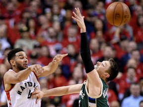 Toronto Raptors guard Cory Joseph moves the ball past Milwaukee Bucks guard Matthew Dellavedova during Game 2 on April 18, 2017. (THE CANADIAN PRESS/Nathan Denette)