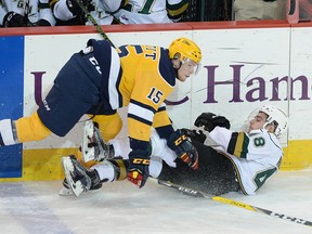 Kyle Petit of the Erie Otters collides with Sam Miletic of the London Knights in Game 7 of the OHL Western Conference semifinals on April 18 at Erie Insurance Arena. [JACK HANRAHAN/ETN]