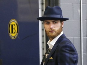 Washington Capitals goalie Braden Holtby grabs a bite during his team’s optional practice at the MasterCard Centre. (Michael Peake/Toronto Sun)