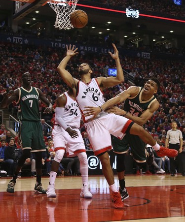 Toronto Raptors Cory Joseph G (6) fights for the ball with Milwaukee Bucks Giannis Antetokounmpo F (34) during the second half of Game 2 in Toronto, Ont. on Wednesday April 19, 2017. Jack Boland/Toronto Sun/Postmedia Network