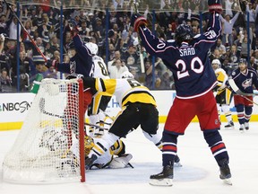 Columbus Blue Jackets' Markus Nutivaara, left, of Finland, and Brandon Saad celebrate a goal against the Pittsburgh Penguins during the second period of Game 4 of an NHL first-round hockey playoff series Tuesday, April 18, 2017, in Columbus, Ohio. (AP Photo/Jay LaPrete)