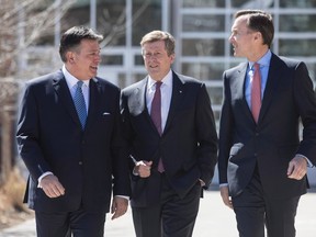 Federal Finance Minister Bill Morneau (right), Ontario Finance Minister Charles Sousa (left) and Toronto Mayor John Tory arrive for talks on the housing market in the Greater Toronto Area in Toronto on Tuesday, April 18, 2017.THE CANADIAN PRESS/Chris Young