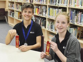 Ryan DeGroot, left, and Kyra Vellinga, right, participated in a regional science fair in London April 11 hosted at London District Christian Secondary School. Both finished with first-place standards and DeGroot was awarded second overall for biological sciences.