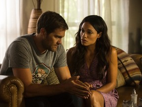 This image released by Warner Bros. Pictures shows Geoff Stults, left, and Rosario Dawson in a scene from, "Unforgettable." (Karen Ballard/Warner Bros. Pictures via AP)