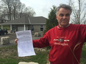 Joe Bardoel, owner of Golden Pond RV Resort west of Ingersoll, shows off the almost 200 signatures he's gathered on a petition urging the government to protect private campgrounds from new tax policies. The CRA has stripped four private campgrounds in Ontario of their small business deduction, a move that means a more than 200 per cent increase in their tax rate. (Jennifer Bieman/Times-Journal)