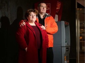 John Jarecsni and Susan Torrie stand beside the ATM where a woman drained their autistic son's bank account. The parents wanted their son's story told but asked he not be photographed to protect his privacy. JULIE OLIVER / POSTMEDIA