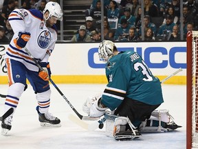 Goalie Martin Jones #31 of the San Jose Sharks blocks the shot of Patrick Maroon #19 of the Edmonton Oilers during the first period in Game Four of the Western Conference First Round during the 2017 NHL Stanley Cup Playoffs at SAP Center on April 18, 2017 in San Jose, California.