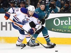 Leon Draisaitl #29 of the Edmonton Oilers battles for control of the puck with Justin Braun #61 of the San Jose Sharks during the first period in Game Three of the Western Conference First Round during the 2017 NHL Stanley Cup Playoffs at SAP Center on April 16, 2017 in San Jose, California.