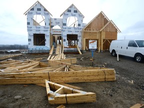 Work continues on a new home on Torrey Pines Way in north London Wednesday. Single detached housing starts, fuelled by Toronto-area buyers, nearly doubled in London in March compared to a year ago. (MORRIS LAMONT, The London Free Press)