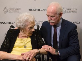 Former Toronto Maple Leaf and Calgary Flames player Lanny McDonald (right) chats with Kay McBeth, 95, the last remaining player of the Edmonton Grads basketball team, following a ceremony in which it was announced that they are to be inducted into the Canada's Sports Hall of Fame in Toronto on Wednesday, April 19 , 2017.