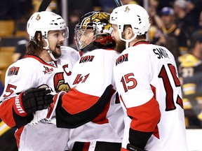 Erik Karlsson of the Ottawa Senators celebrates with Craig Anderson and Zack Smith after defeating the Boston Bruins 1-0 during Game 4 at TD Garden on April 19, 2017. (Maddie Meyer/Getty Images)