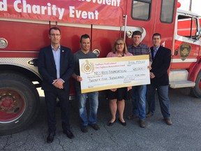 From left: Kris Volpel, president of SPFFA; Wade Bretschnider, Greater Sudbury firefighter; Patricia Mills, president of NEO Kids Foundation; Hugh Duncan, chair of the SPFFA Benevolent Fund; and Michael Blinn, owner of Pixatron Photography. (Photo supplied)