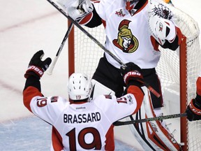 Ottawa Senators goalie Craig Anderson is congratulated by centre Derick Brassard after shutting out the Boston Bruins during Game 4 on April 19, 2017. (AP Photo/Charles Krupa)