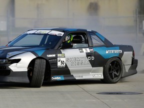 Normand Burwash puts on a drifting demo outside the 2017 Edmonton Motorshow held at the Edmonton Expo Centre April 20 to 23, 2017. Larry Wong / Postmedia