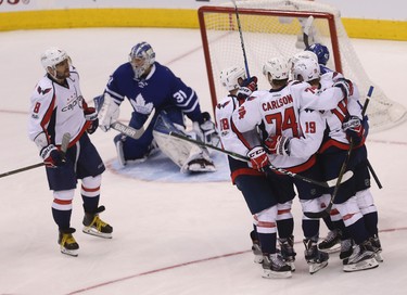 Toronto Maple Leafs�Frederik Andersen G (31) reaches for the puck against just before Washington Capitals T.J. Oshie RW (77) pounces on it to score the first goal during the first period of Game 4 in Toronto on Wednesday April 19, 2017. Jack Boland/Toronto Sun/Postmedia Network