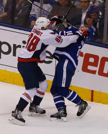 Washington Capitals Nate Schmidt D (88) girls Toronto Maple Leafs�Mitch Marner C (16) a hard check during the second period of Game 4 in Toronto on Wednesday April 19, 2017. Jack Boland/Toronto Sun/Postmedia Network
