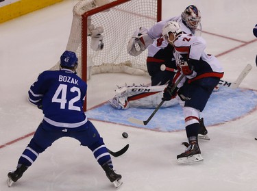 Washington Capitals Matt Niskanen D (2) swats the puck away from Toronto Maple Leafs�Tyler Bozak C (42) during a two-man power play during the third period of Game 4 in Toronto on Wednesday April 19, 2017. Jack Boland/Toronto Sun/Postmedia Network
