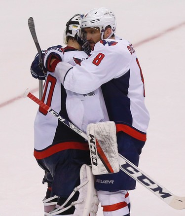 Washington Capitals Alex Ovechkin LW (8) hugs goalie Braden Holtby G (70)after winning 5-4  in Game 4 in Toronto on Wednesday April 19, 2017. Jack Boland/Toronto Sun/Postmedia Network