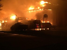 A photo provided by Lambton OPP shows a home on Victoria Street in Camlachie engulfed in flames overnight Thursday. Police said all of the residents of the home escaped safely and the cause of the fire is being investigated by the Ontario  Fire Marshal's office.
Handout/Sarnia Observer/Postmedia Network
