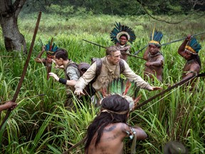 This image released by Amazon Studios/Bleecker Street Films shows Tom Holland, center left, and Charlie Hunnam, center left, in a scene from "The Lost City of Z." (Aidan Monaghan/Amazon Studios/Bleecker Street via AP)