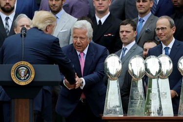 WASHINGTON, DC - APRIL 19:  New England Patriots owner Robert Kraft (C) is congratulated by U.S. President Donald Trump during an event celebrating the team's Super Bowl win on the South Lawn at the White House April 19, 2017 in Washington, DC. It was the team's fifth Super Bowl victory since 1960.  (Photo by Chip Somodevilla/Getty Images)