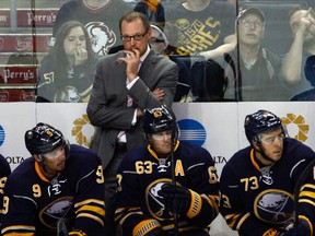 Buffalo Sabres Head Coach Dan Bylsma looks at the ice at the scoreboard during a game against the Ottawa Senators at the First Niagara Center on September 23, 2015 in Buffalo, New York. (Photo by Tom Brenner/ Getty Images)