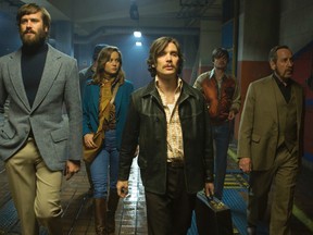 This image released by A24 shows, from left, Armie Hammer, Brie Larson, Cillian Murphy, Sam Riley and Michael Smiley in a scene from "Free Fire." (Kerry Brown/A24 via AP)