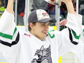 Portage captain Riley Thiessen hoists the Turnbull Cup over his head follow his team's Game 6 victory at Stride Place in Portage la Prairie, Man., Wednesday, April 19, 2017. (Brian Oliver/The Graphic)