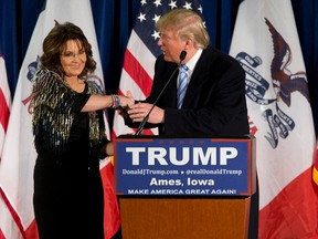 In this Jan. 19, 2016, file photo, former Alaska Gov. Sarah Palin, left, endorses then-Republican presidential candidate Donald Trump during a rally at the Iowa State University in Ames, Iowa. President Donald Trump hosted former Palin at a White House dinner with musicians Ted Nugent and Kid Rock on April 19, 2017. (AP Photo/Mary Altaffer, File)