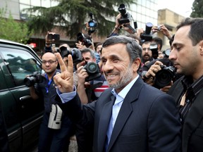 In this Wednesday, April 12, 2017 file photo, former Iranian President Mahmoud Ahmadinejad flashes the victory sign as he arrives at the Interior Ministry to register his candidacy for the upcoming presidential elections, in Tehran, Iran. Over 1,600 people registered to run. Under Iranian law, there's no fee for registering. Hopefuls only must believe in Iran's form of government and be Shiite Muslims. (AP Photo/Ebrahim Noroozi, File)