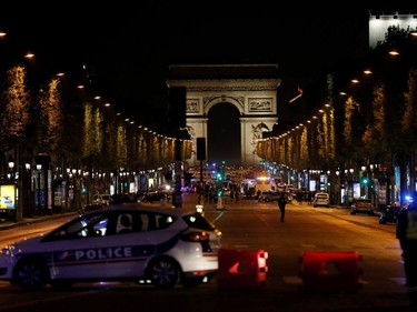 Police officers block the access to the Champs Elysees in Paris after a shooting on April 20, 2017.  THOMAS SAMSON/AFP/Getty Images