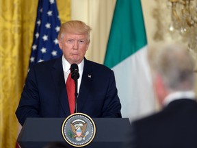 U.S. President Donald Trump, left, listens to question during a news conference with Italian Prime Minister Paolo Gentiloni in the East Room of the White House in Washington, Thursday, April 20, 2017. (AP Photo/Susan Walsh)