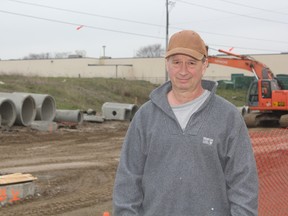 Dean Stack, owner of St. Thomas Upholstery, said he’s happy about the construction on First Avenue in front of his store. It’s only caused him minor inconveniences that he said are worth it for what he said will be a better road in the end. (Laura Broadley/Times-Journal)